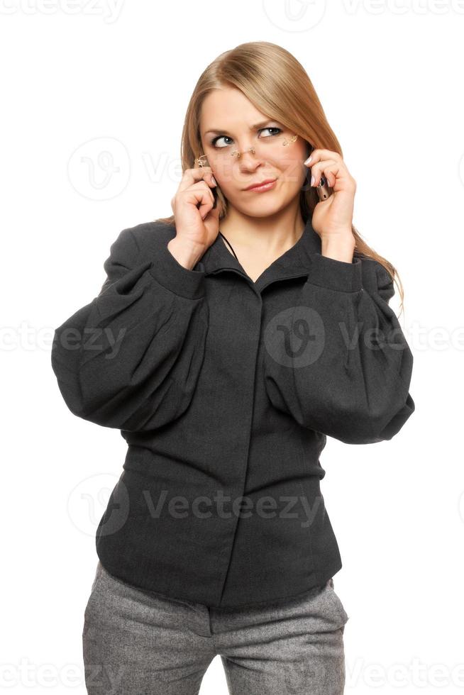 missnöjd ung blond i en grå företag kostym foto