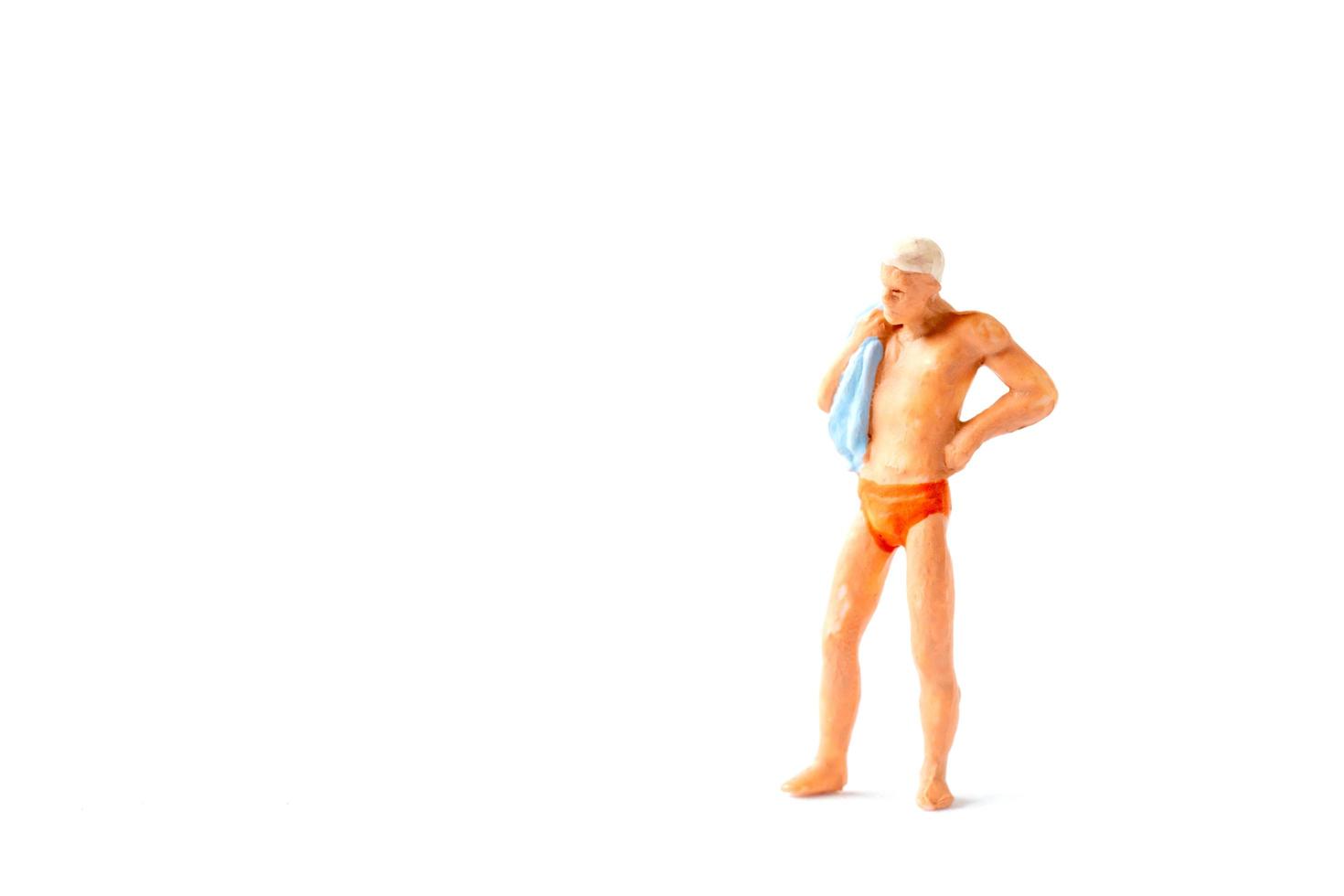 miniatyrfigur person som bär en speedo foto