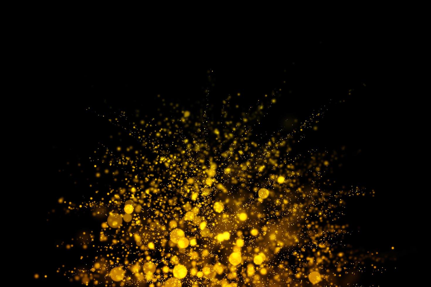 suddiga guldcirklar på svart bakgrund foto