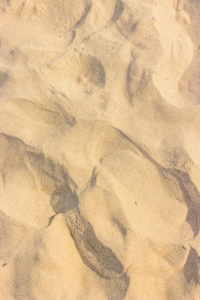 sand på stranden för textur eller bakgrund foto