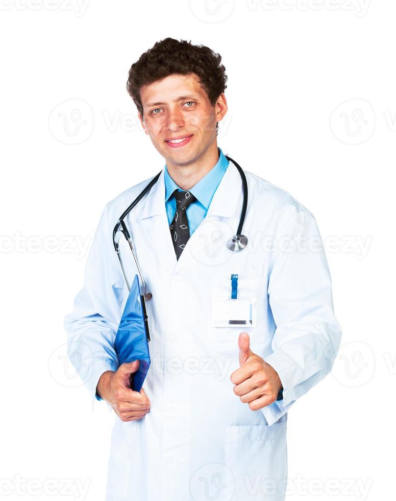 porträtt av en leende manlig läkare innehav en anteckningsblock och finger upp på vit foto