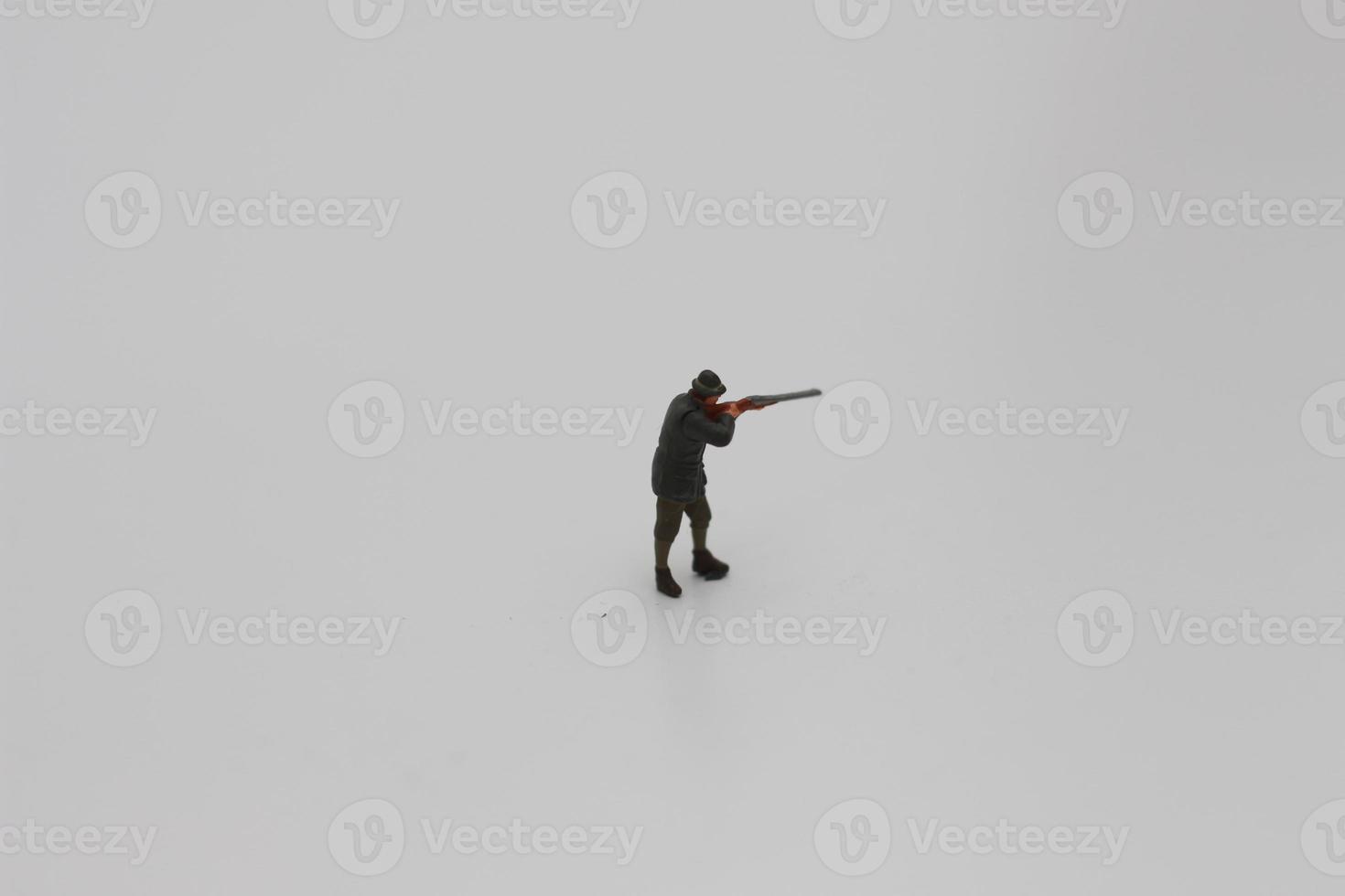 en stänga upp av miniatyr- figur av en jägare foto