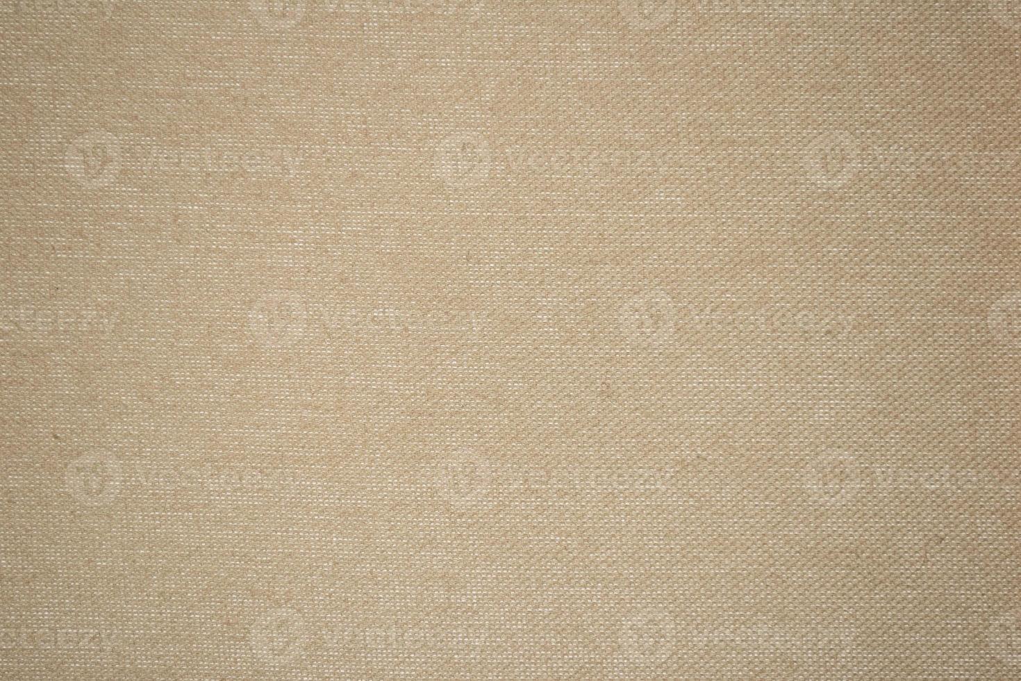 en beige tyg bakgrund textur full ram foto