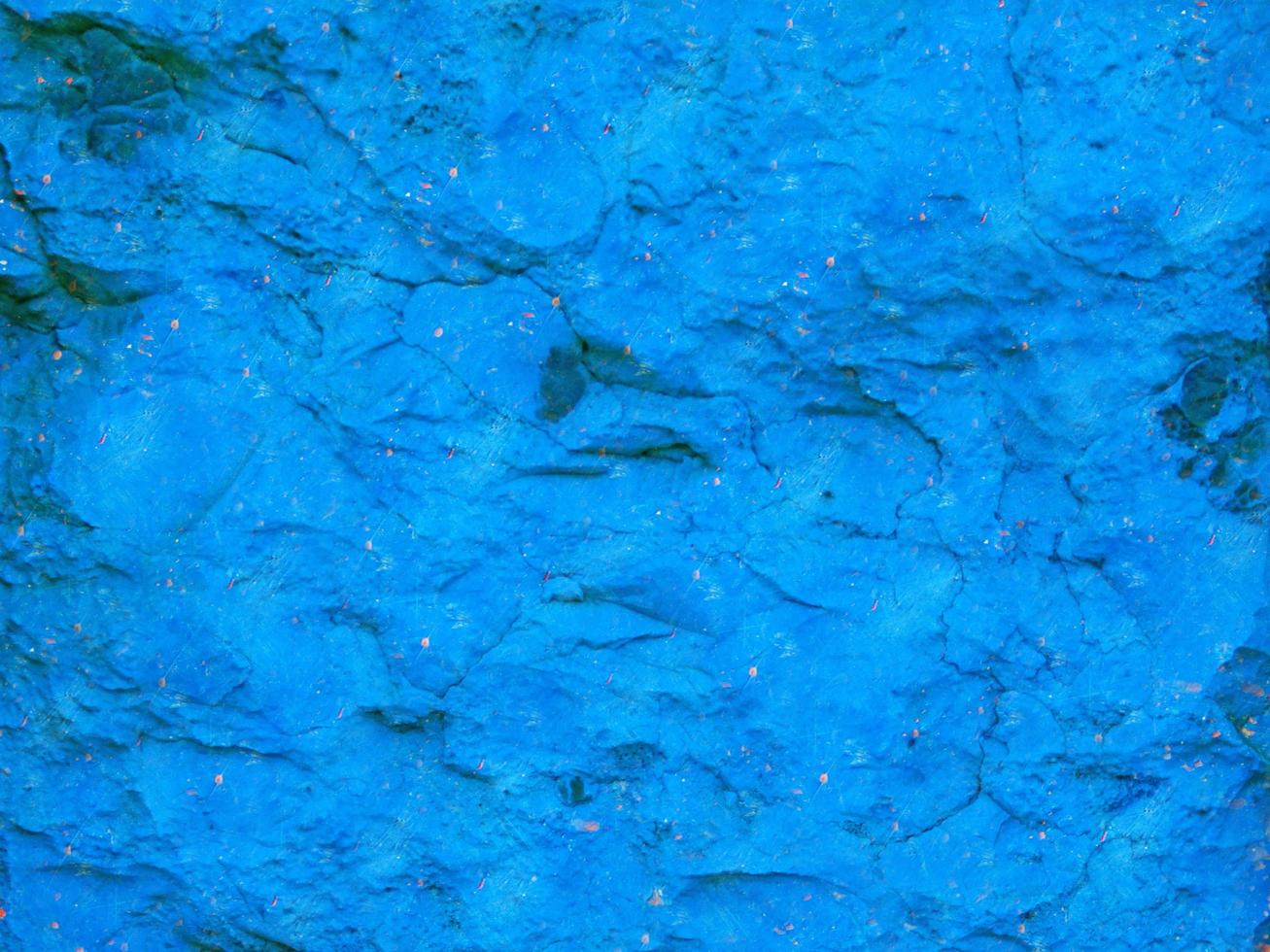 närbild av blå sten eller stenmur för bakgrund eller konsistens foto