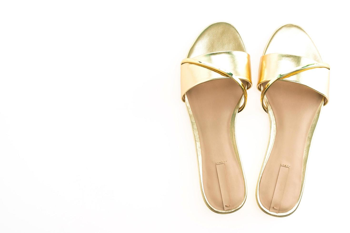 vackra sandalskor i guld foto