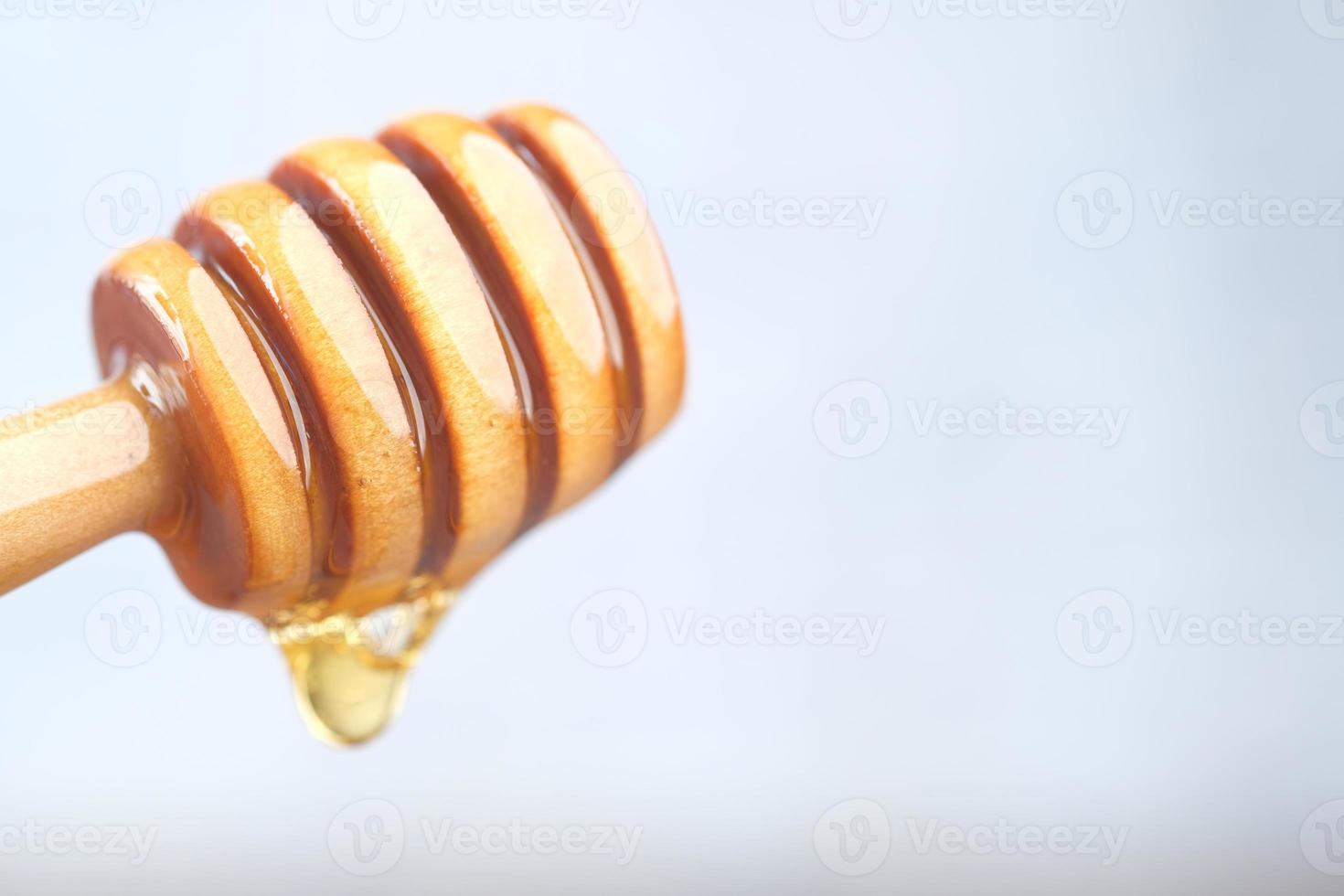 färsk honung skopa foto
