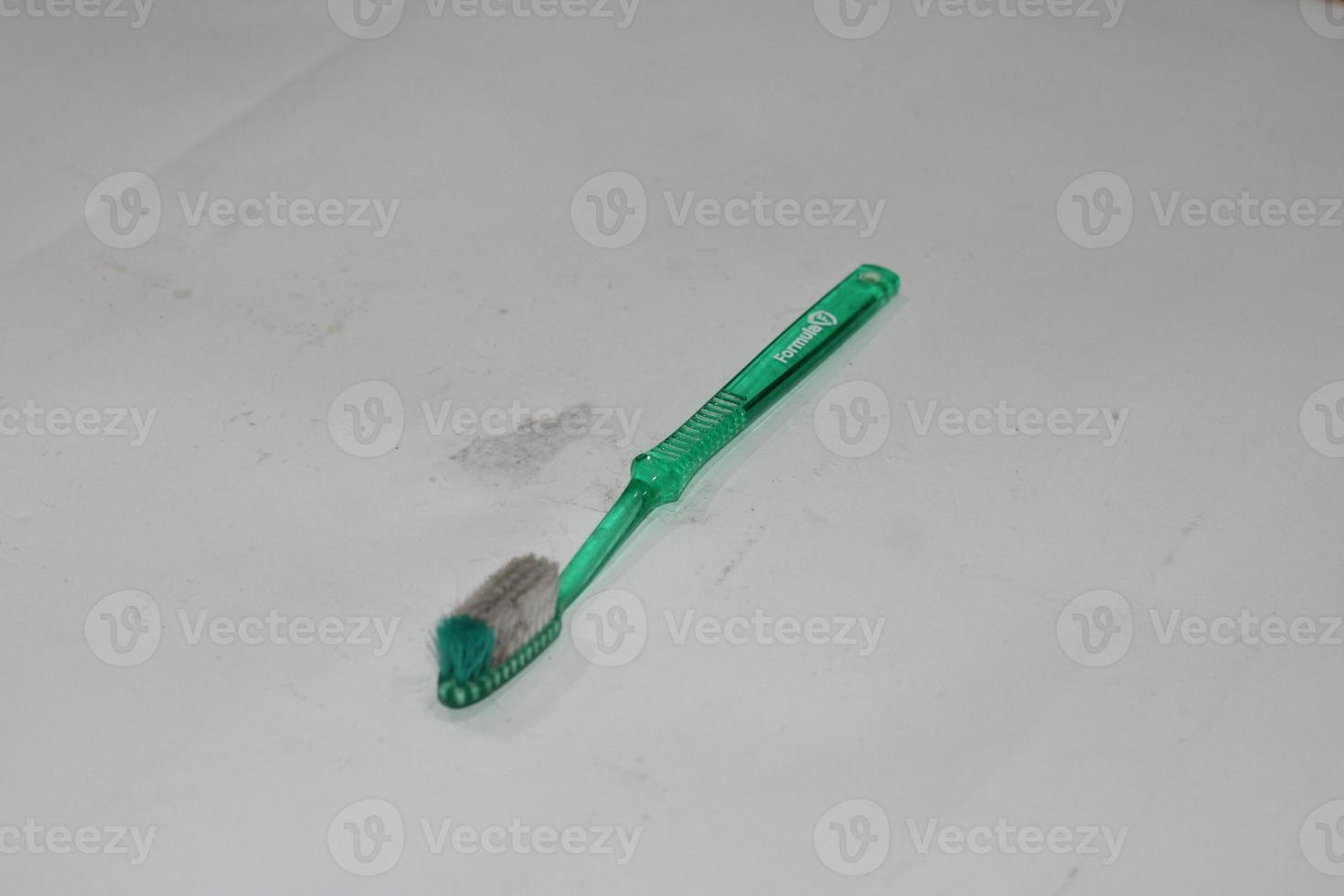 Foto av en ljus grön tandborste