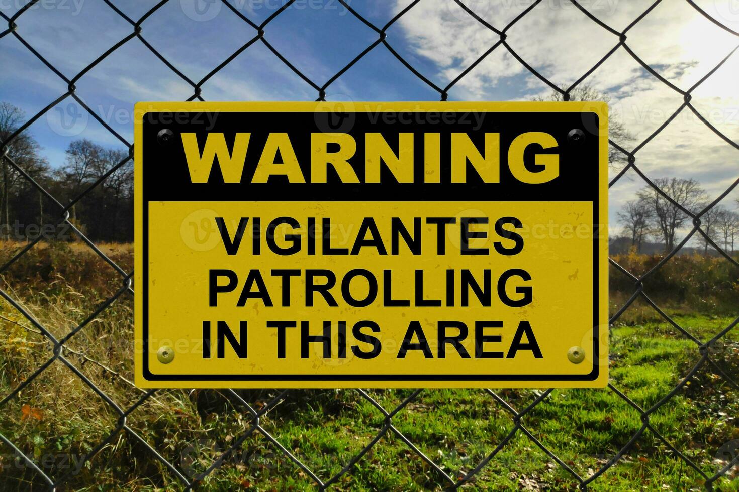 varning - vigilantes patrullering i detta område foto