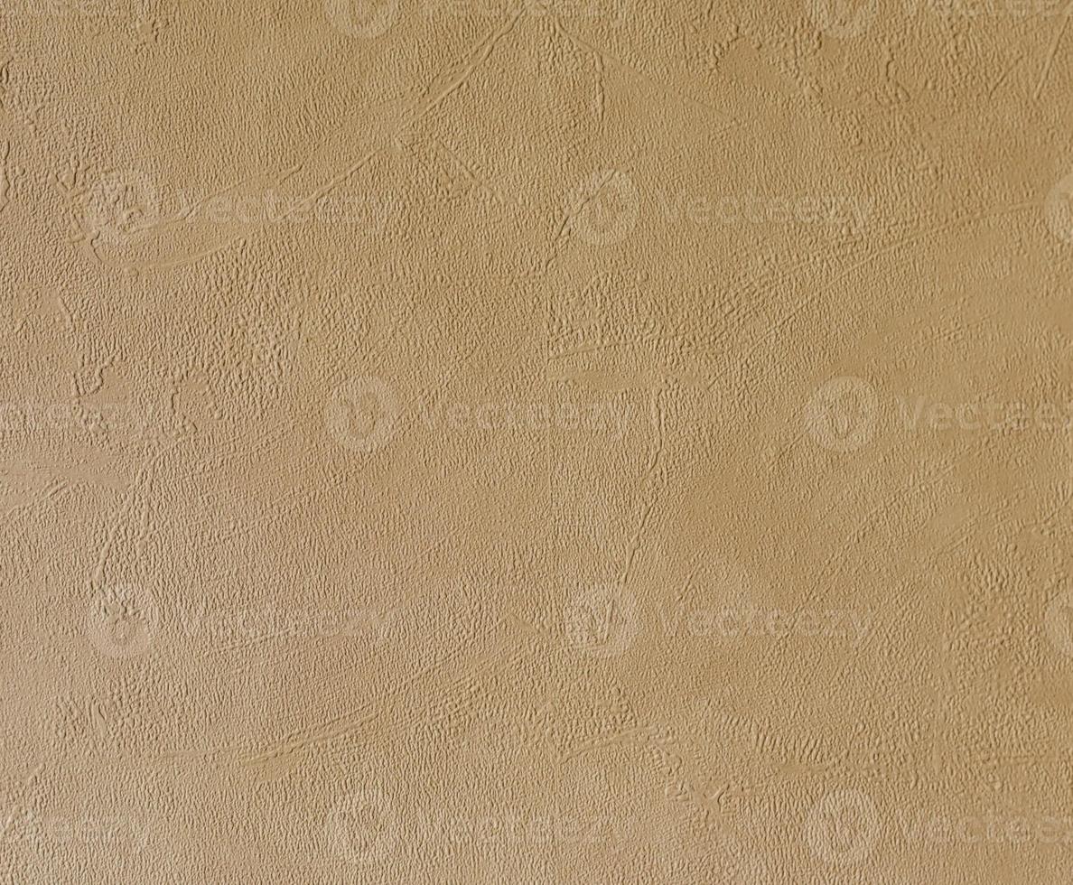 ljus beige grov putsad husvägg som bakgrund foto