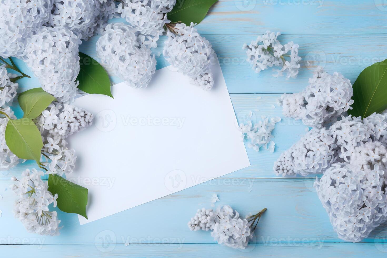 lila blommor och löv och en ark av papper på blå trä- bakgrund, kopia Plats, topp se. ai genererad. foto