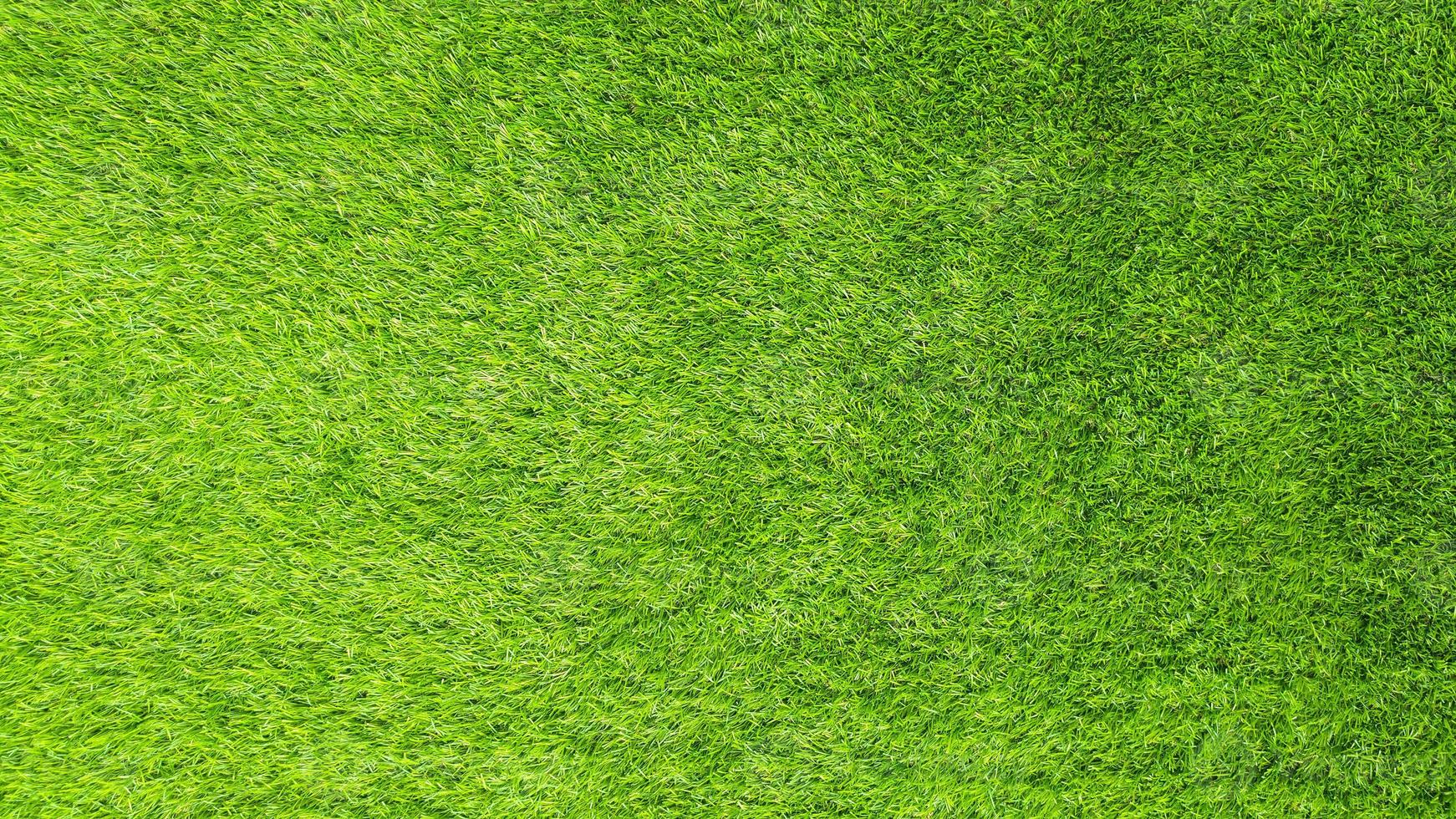 konstgjord grönt gräs bakgrund foto