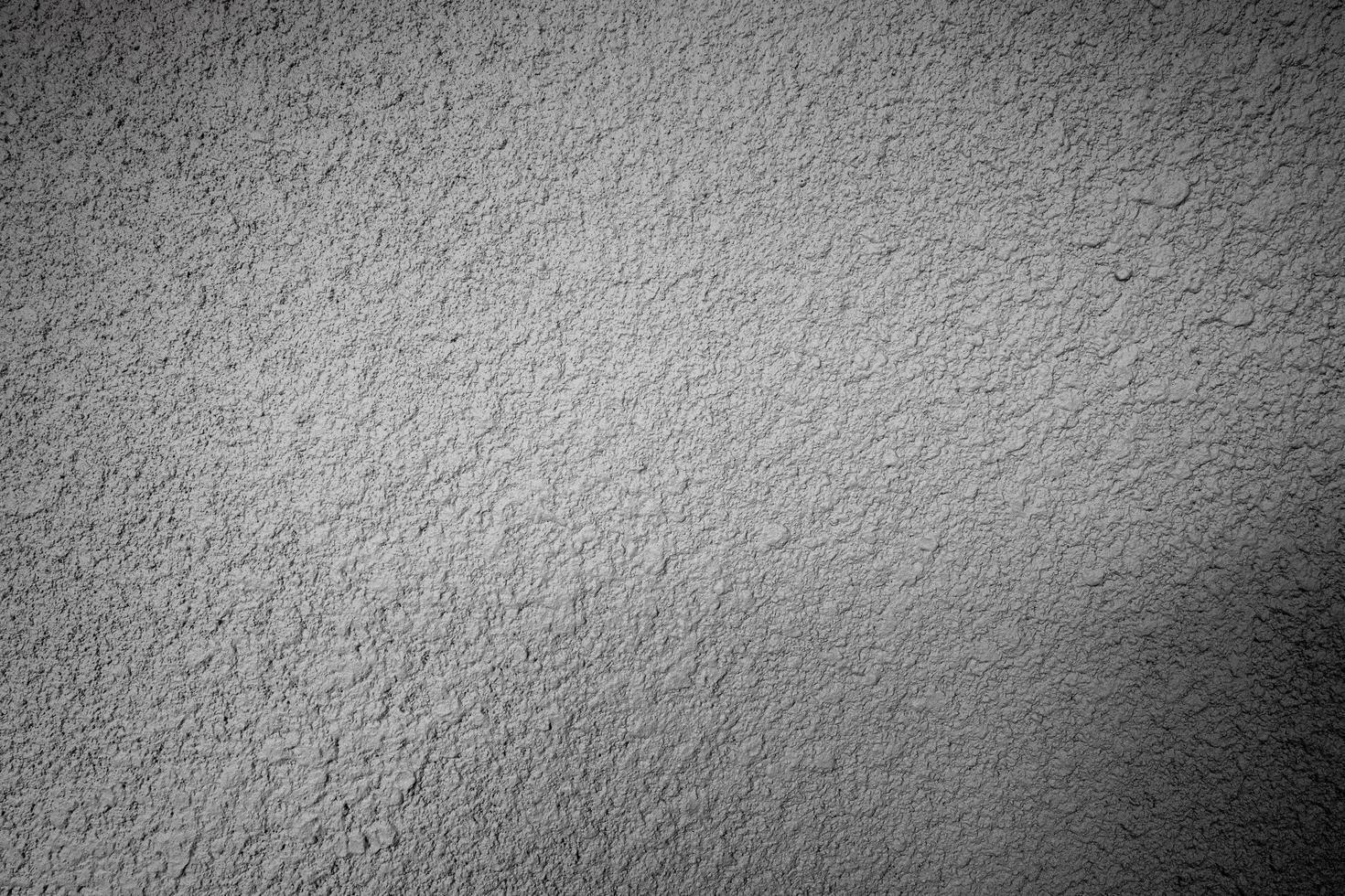 vit och svart stuckatur betongvägg yta textur bakgrund foto