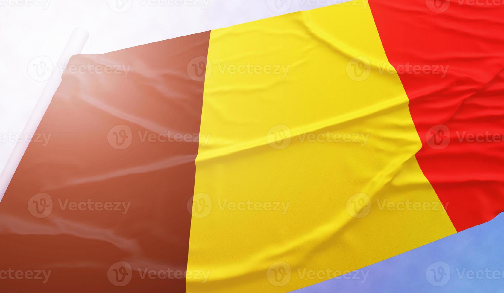 Belgiens flagga på den blå himlen foto