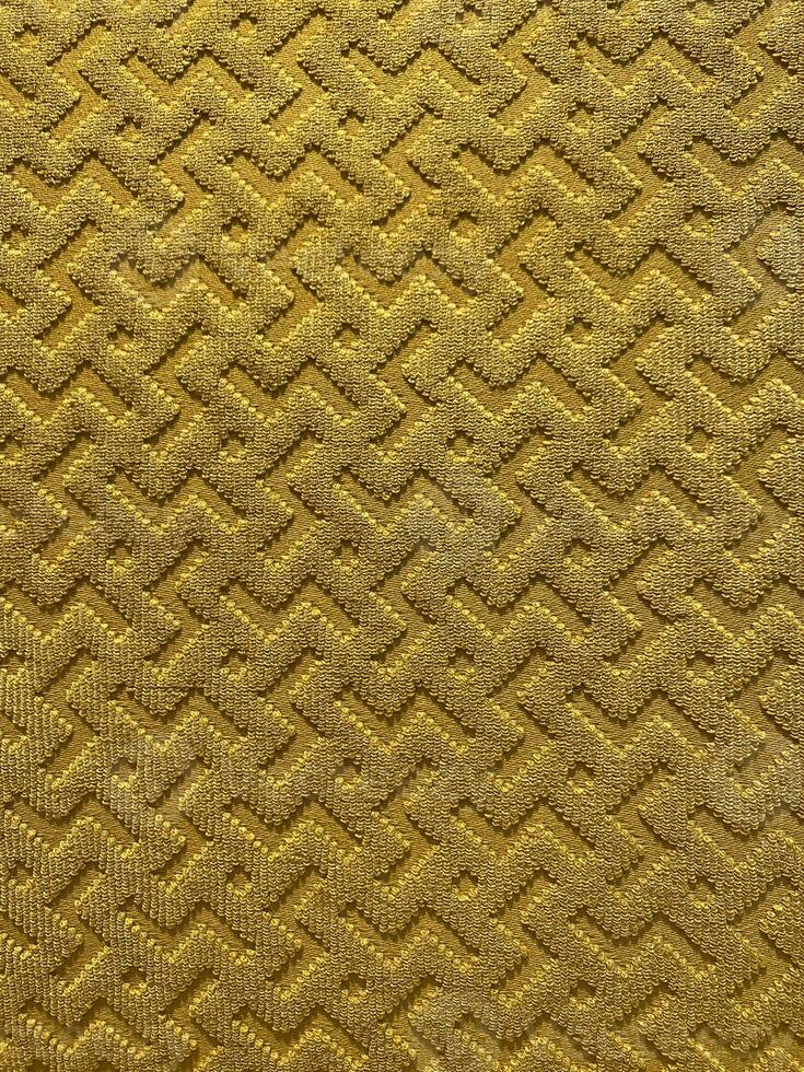 guld Färg sammet draperi textil. mönster bakgrund. foto