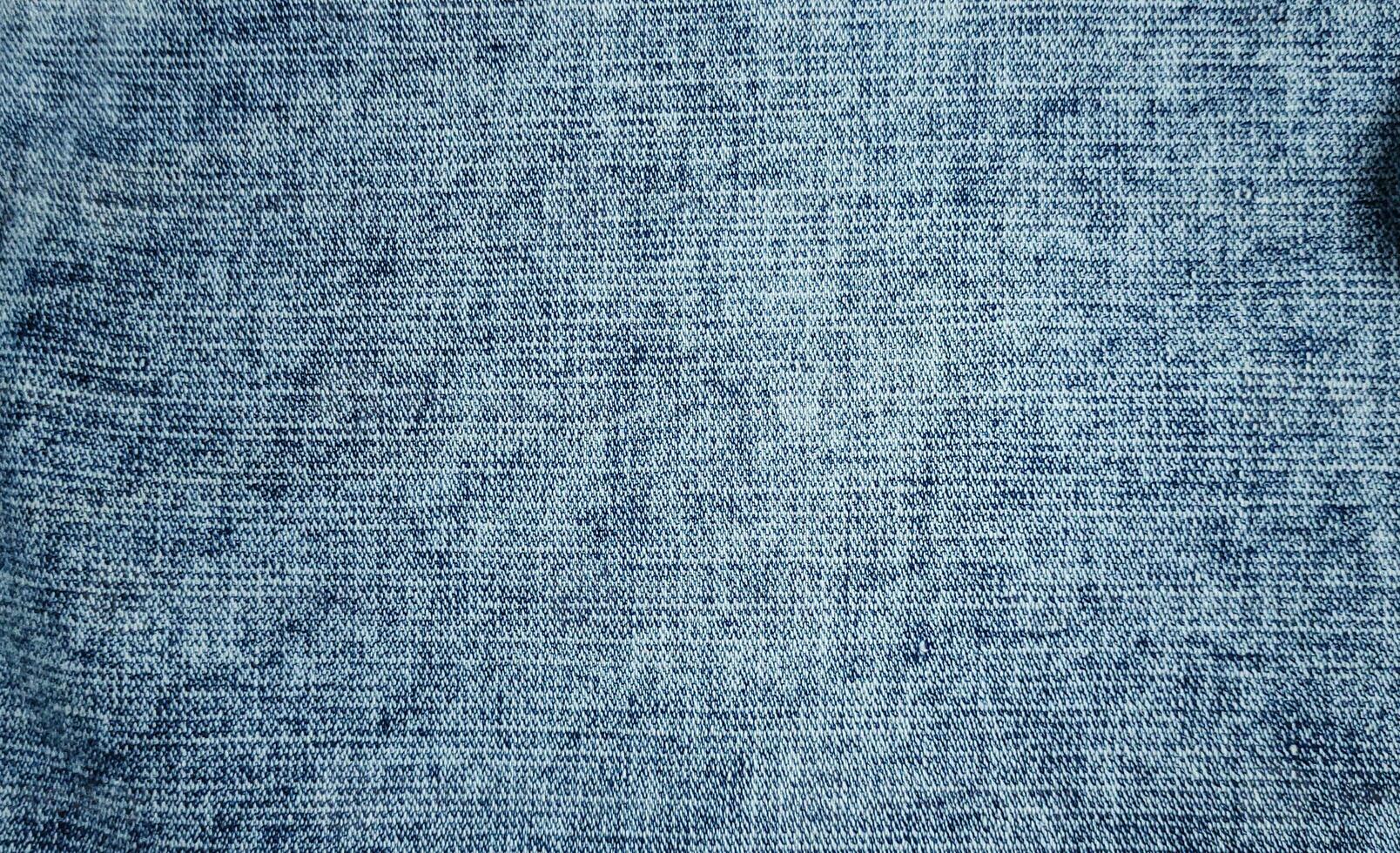 ljus blå denim tyg stänga upp fotografi bakgrund, sten tvätta denim jeans trasa, denim textur, foto