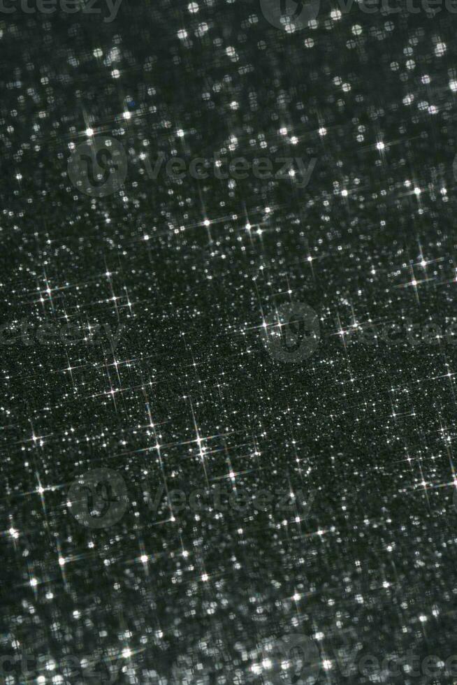 abstrakt svart bakgrund med pärlar i de form av stjärnor. foto