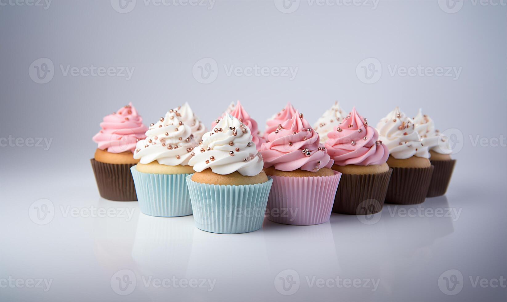 muffins med blå och rosa dekoration på vit bakgrund, stänga upp se. ai genererad foto