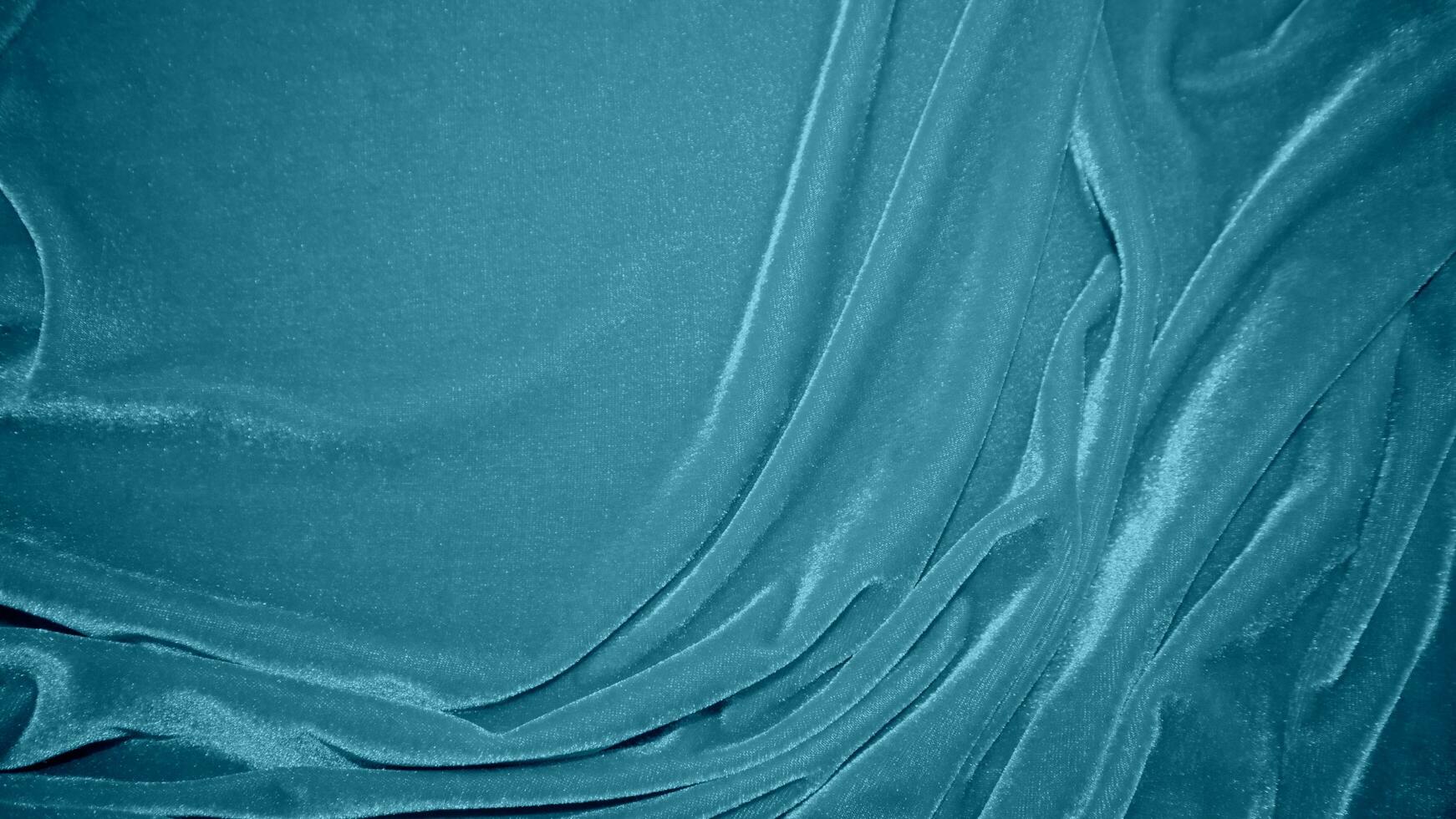blå sammet tyg textur Begagnade som bakgrund. hav Färg panne tyg bakgrund av mjuk och slät textil- material. krossad sammet .lyx Marin tona för silke. foto