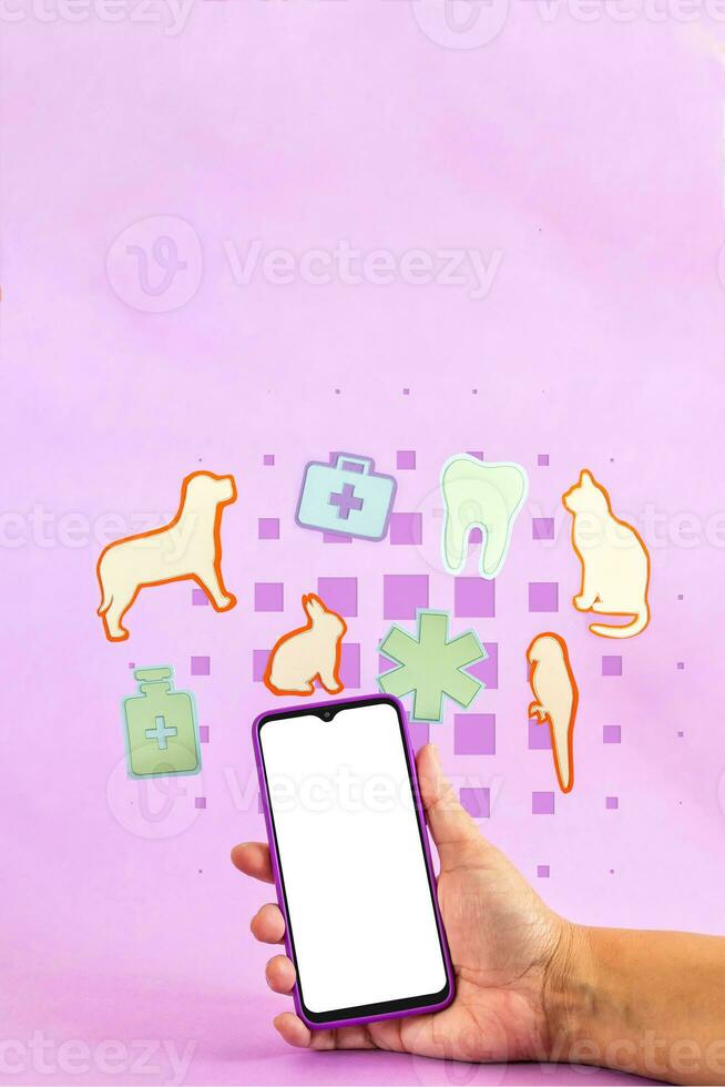 smart telefon omgiven förbi djur- och medicin former på lila bakgrund. veterinär begrepp. foto