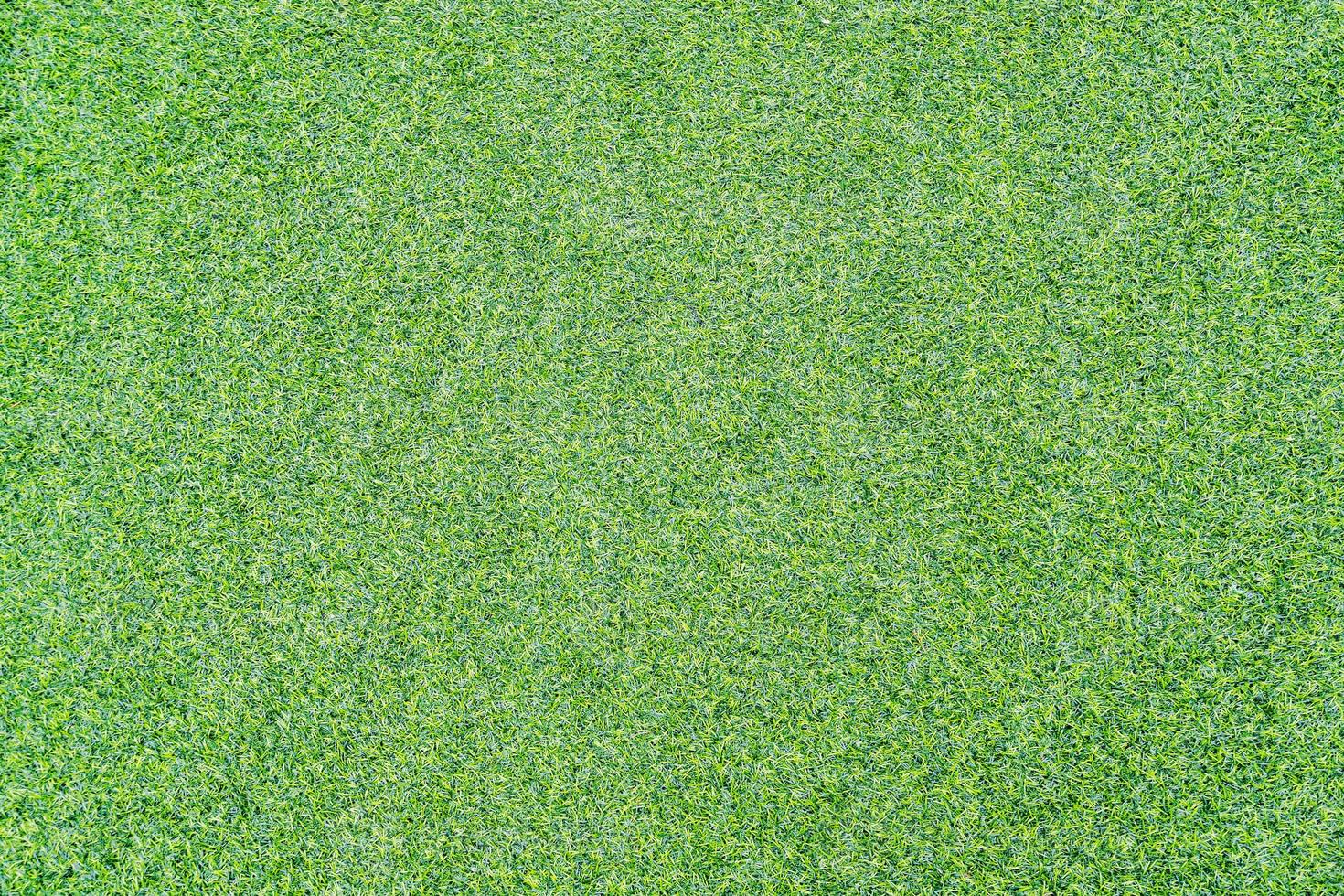 ovanifrån foto, konstgjord grönt gräs textur bakgrund foto