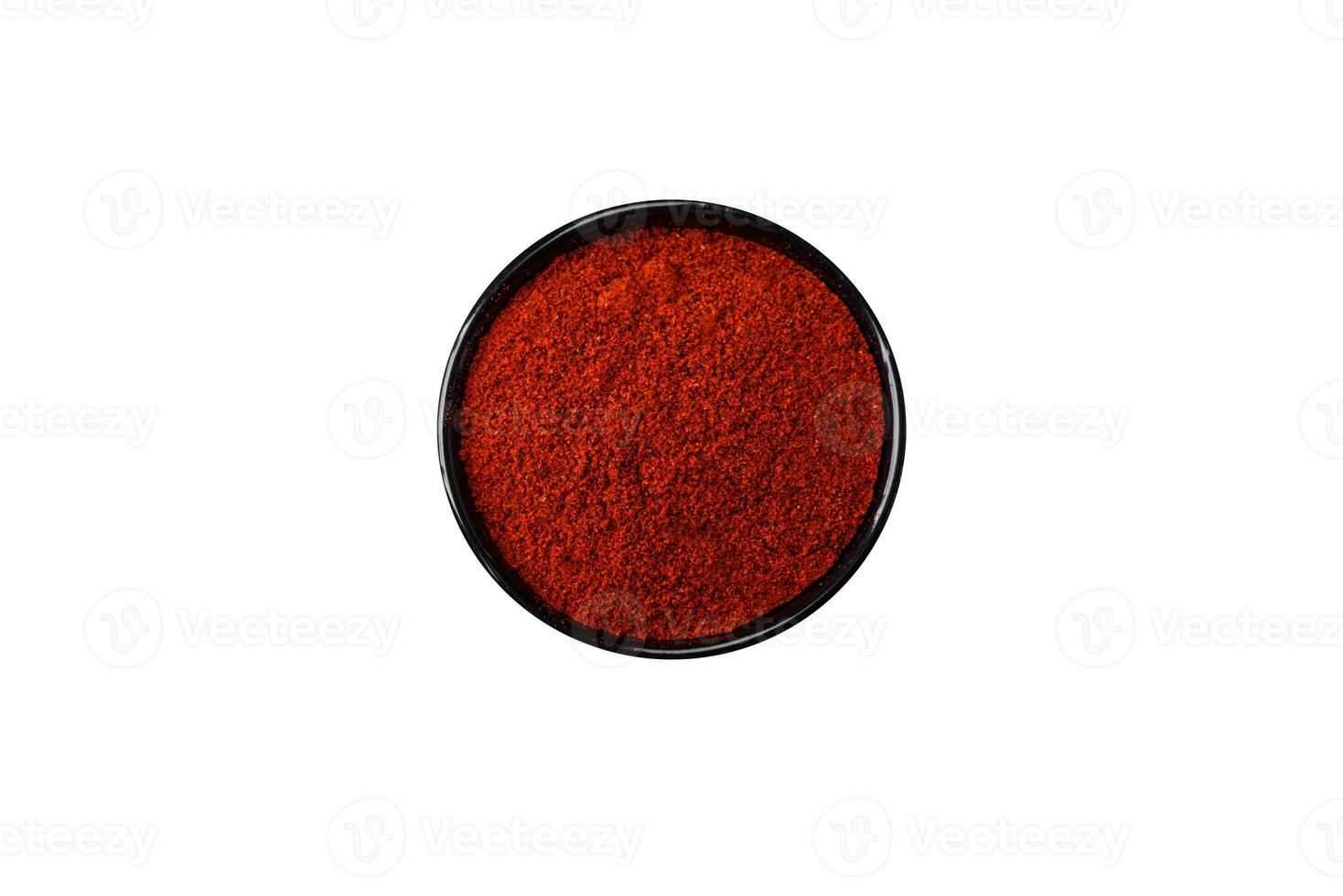 krydda rökt paprika i de form av pulver i skålar och skedar foto
