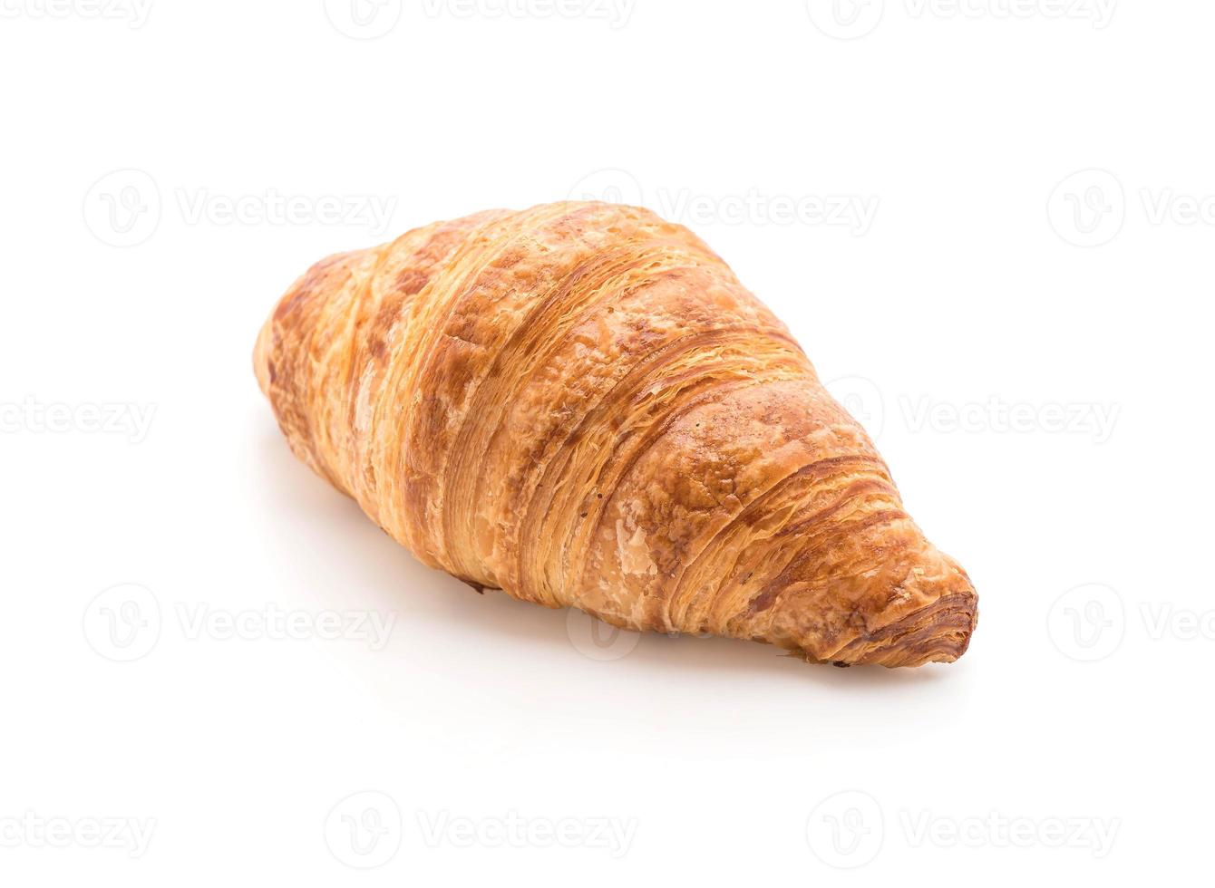 smörcroissant på vit bakgrund foto