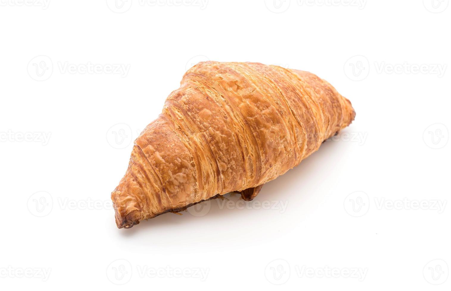 smörcroissant på vit bakgrund foto