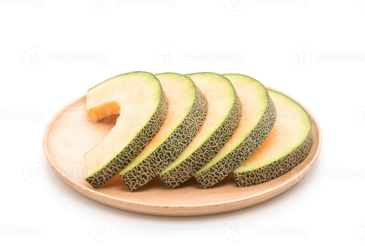 cantaloupmelon på vit bakgrund foto