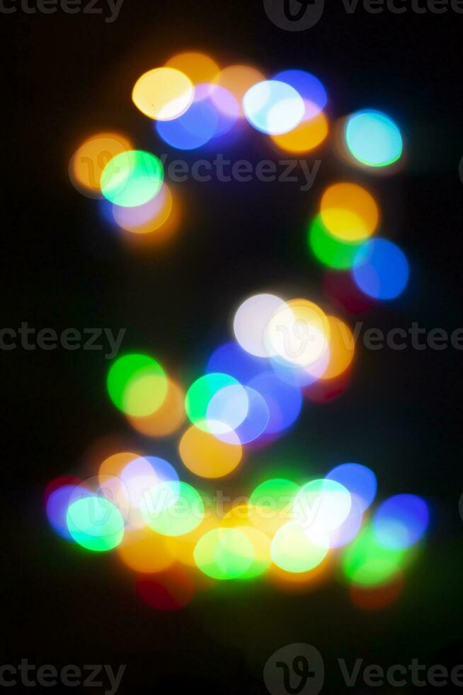 siffra 2 tillverkad med de bokeh av jul lampor foto