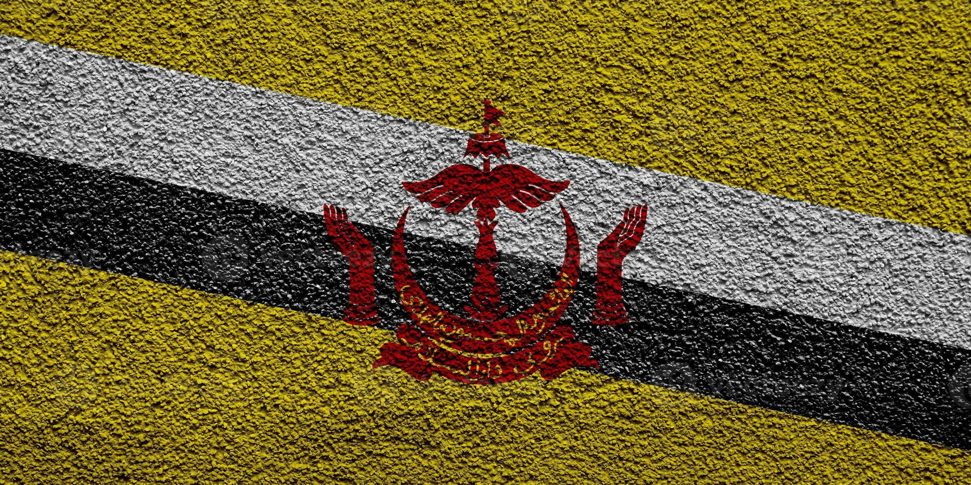 flagga av brunei darussalam på en texturerad bakgrund. begrepp collage. foto