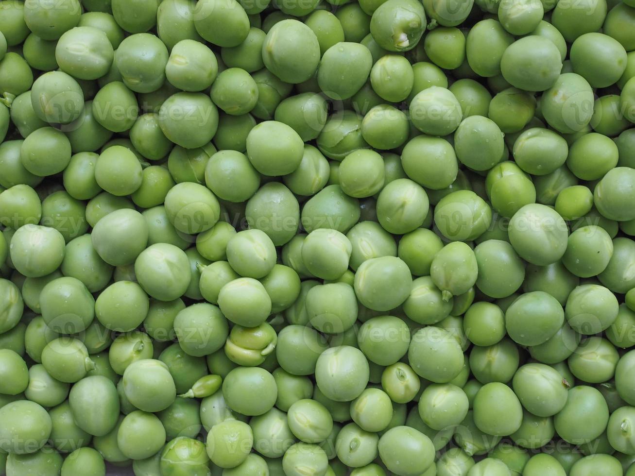 gröna ärtor grönsaksbakgrund foto