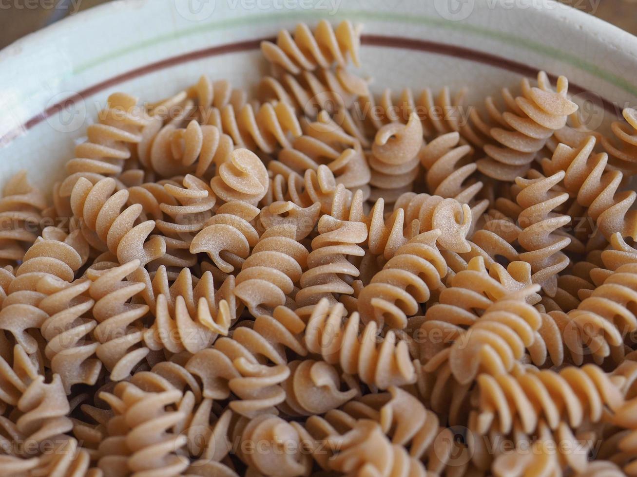 fusilli italiensk pasta bakgrund foto