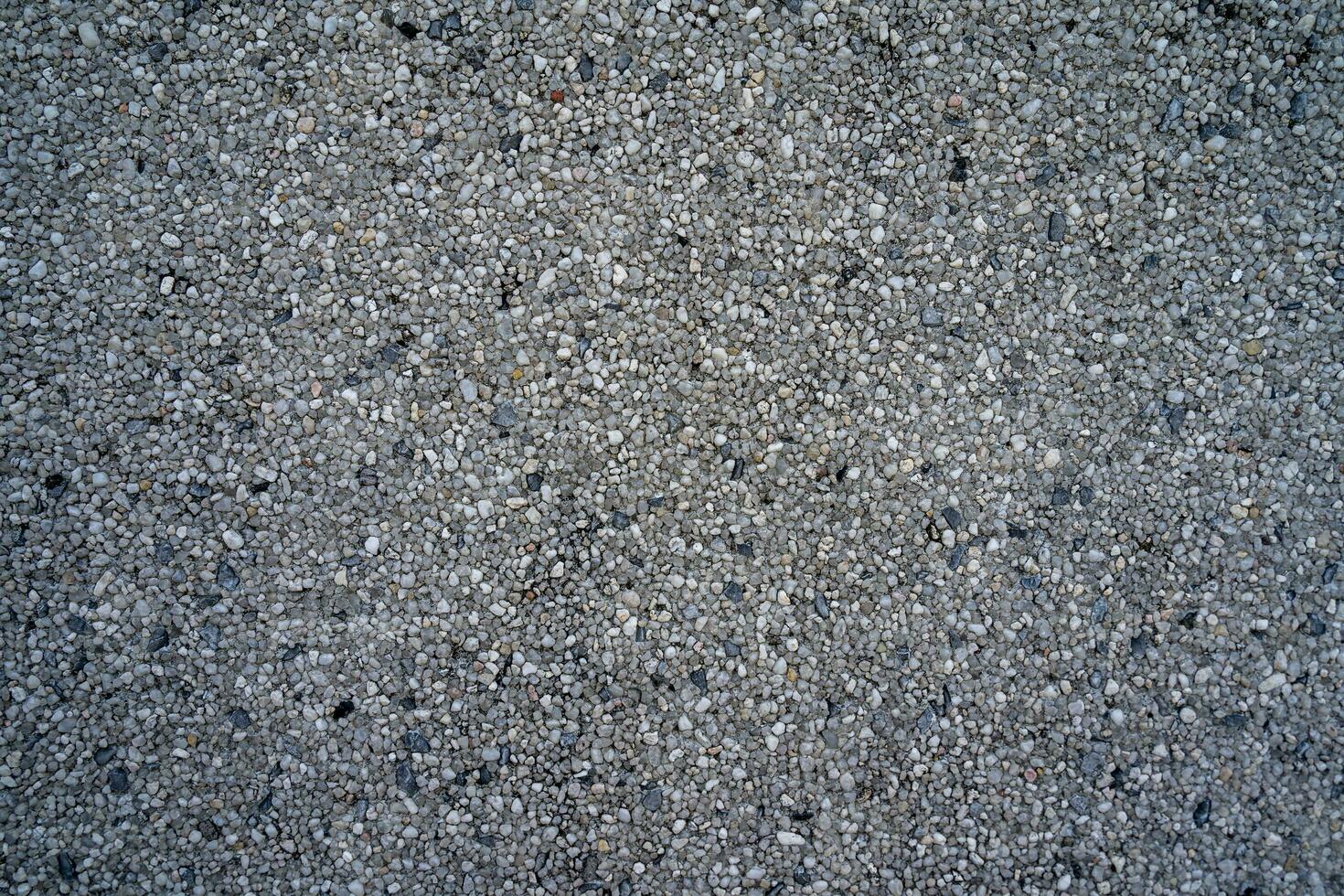 många små och grå stenar, sömlös textur foto