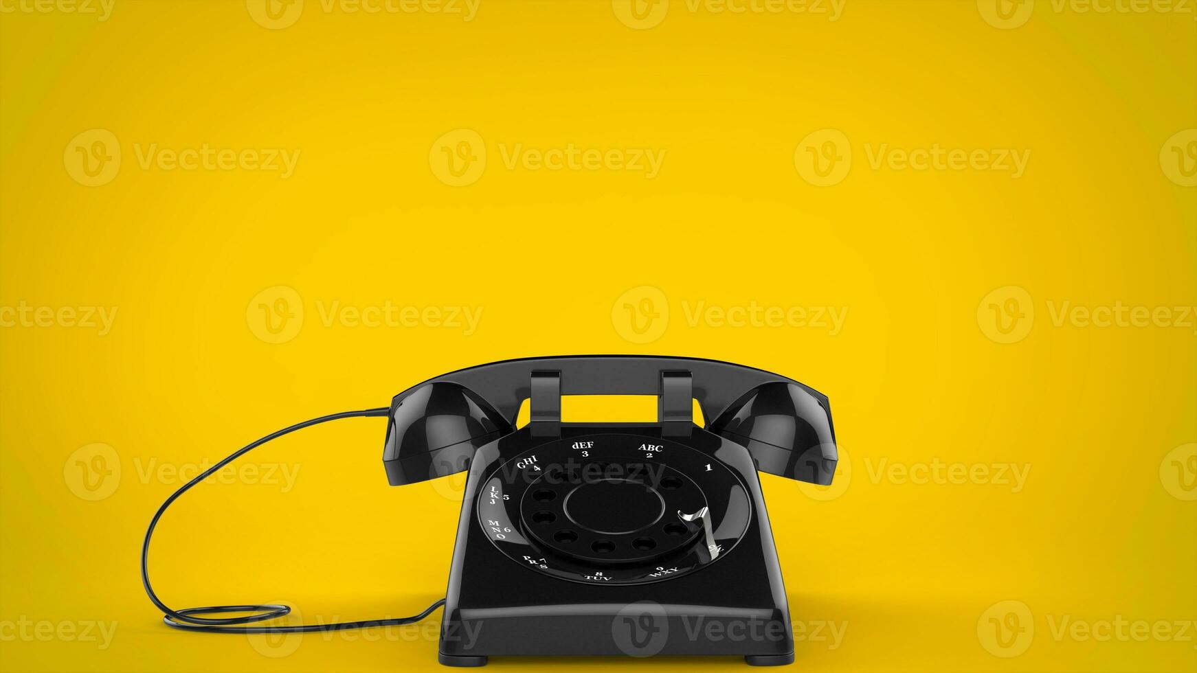 svart retro styled telefon på gul bakgrund foto