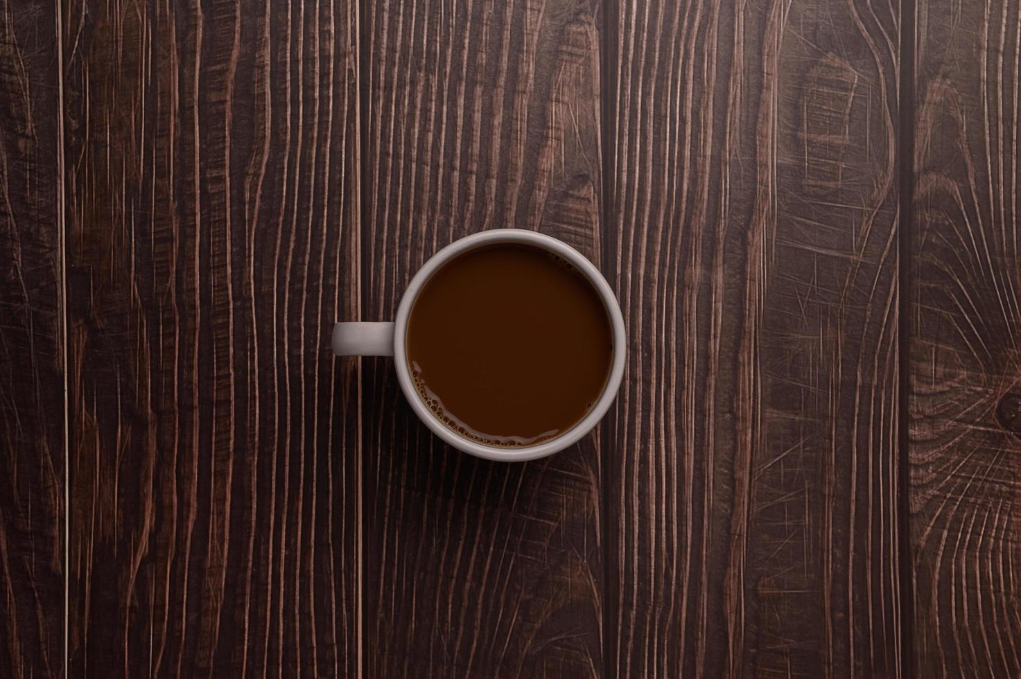 kaffemugg på träbakgrund foto