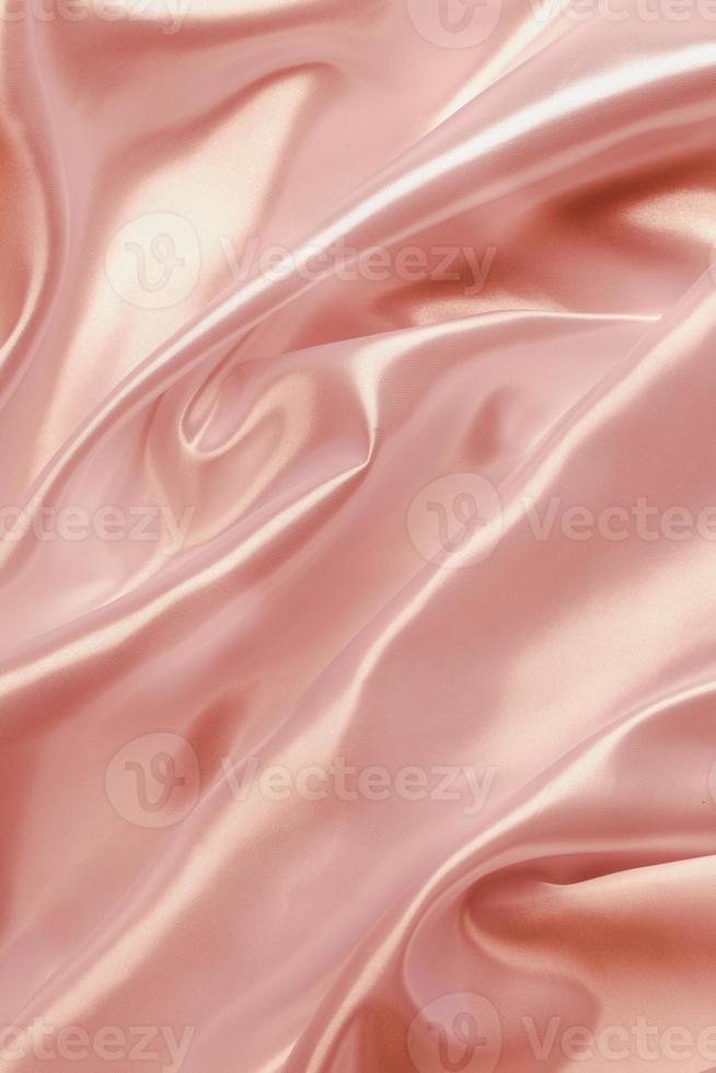 abstrakt rosa guld satin silkeslen tyg för bakgrund foto