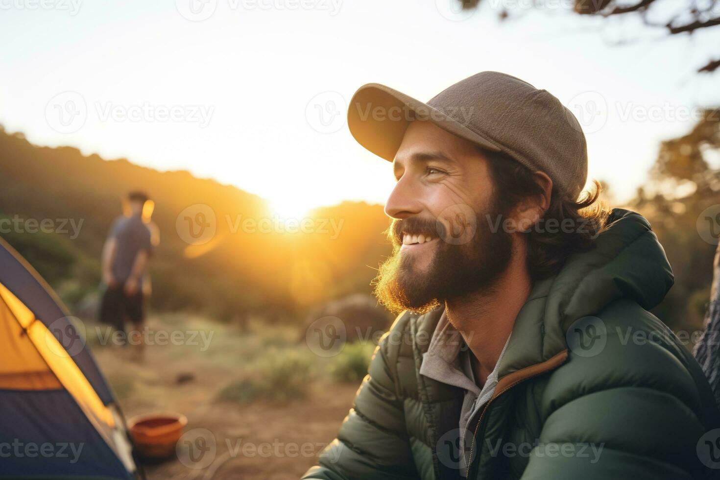 porträtt av man ser på kamera medan nära camping tält på solnedgång ai genererad foto