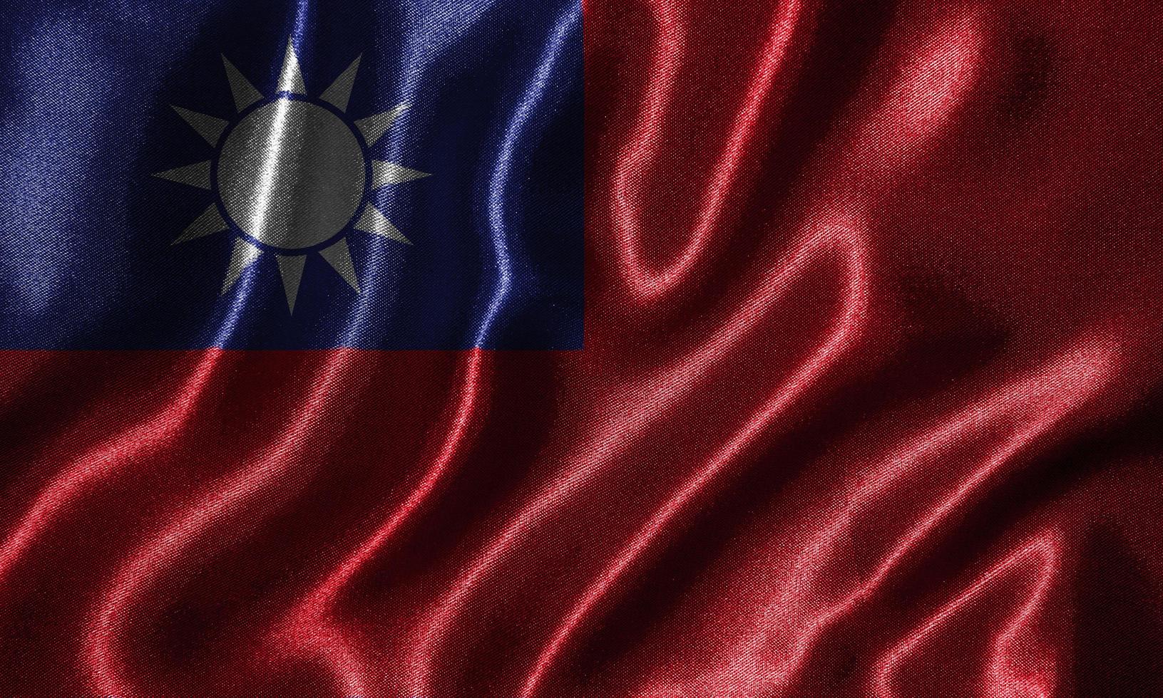 tapet av taiwanesiska flaggan och viftande flagga efter tyg. foto