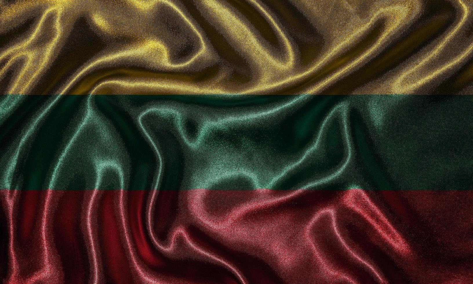 tapeter av litauens flagga och viftande flagga av tyg. foto