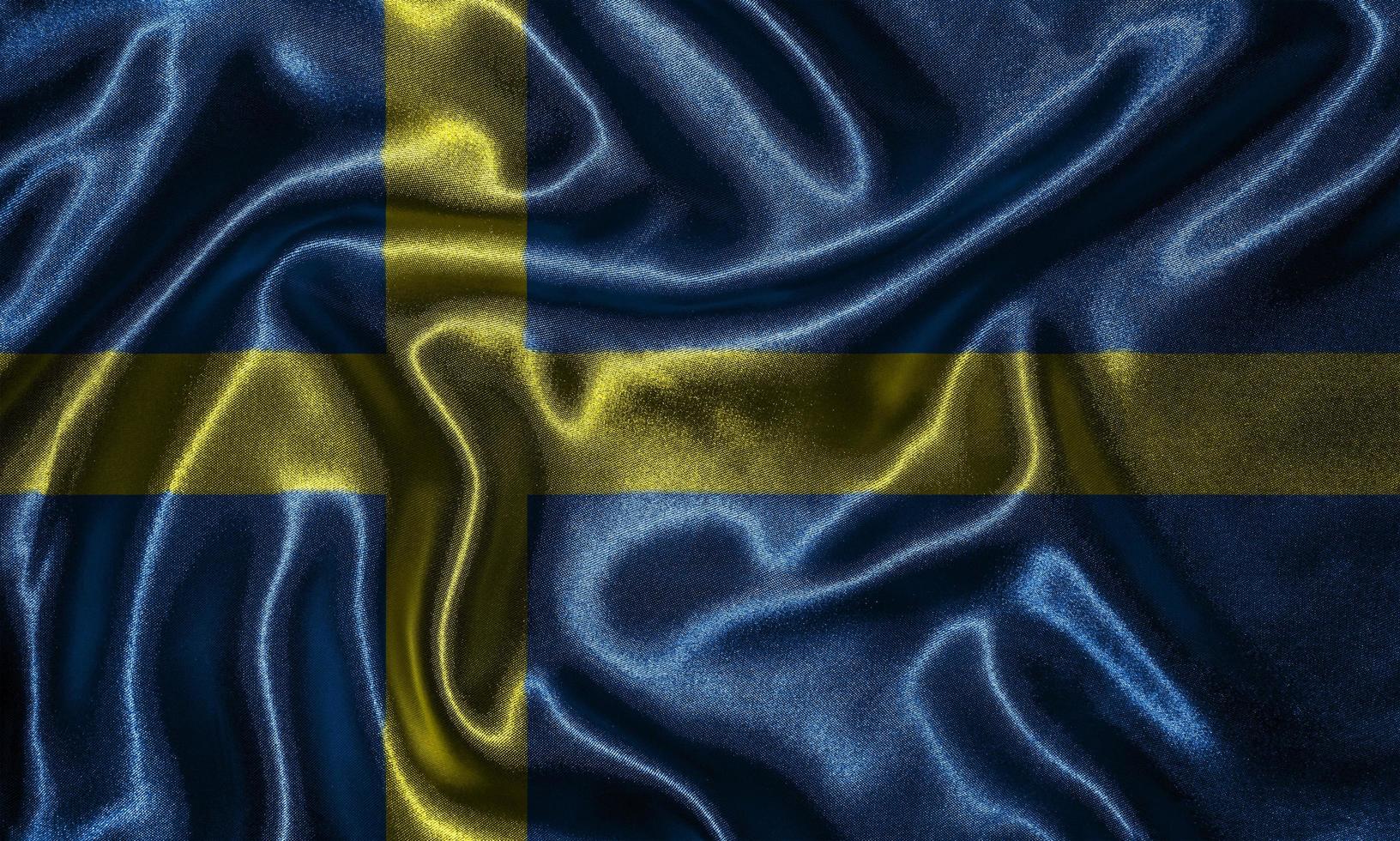 tapeter av sveriges flagga och viftande flagga av tyg. foto