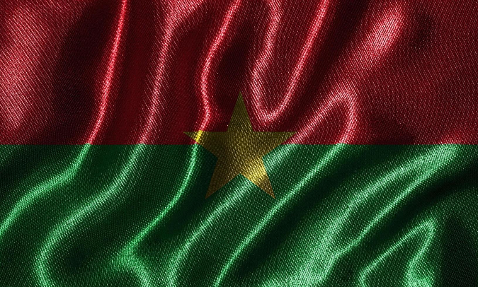 tapet av burkina faso flagga och viftande flagga av tyg. foto