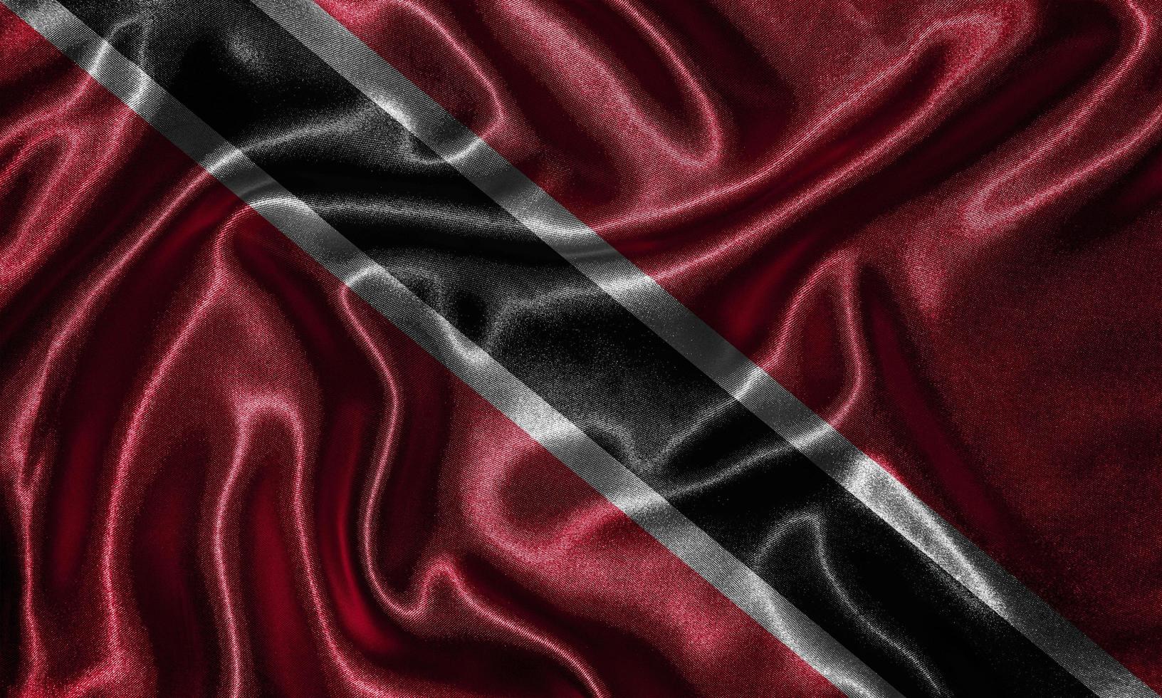 tapet av trinidad och tobago flagga och viftande flagga av tyg. foto