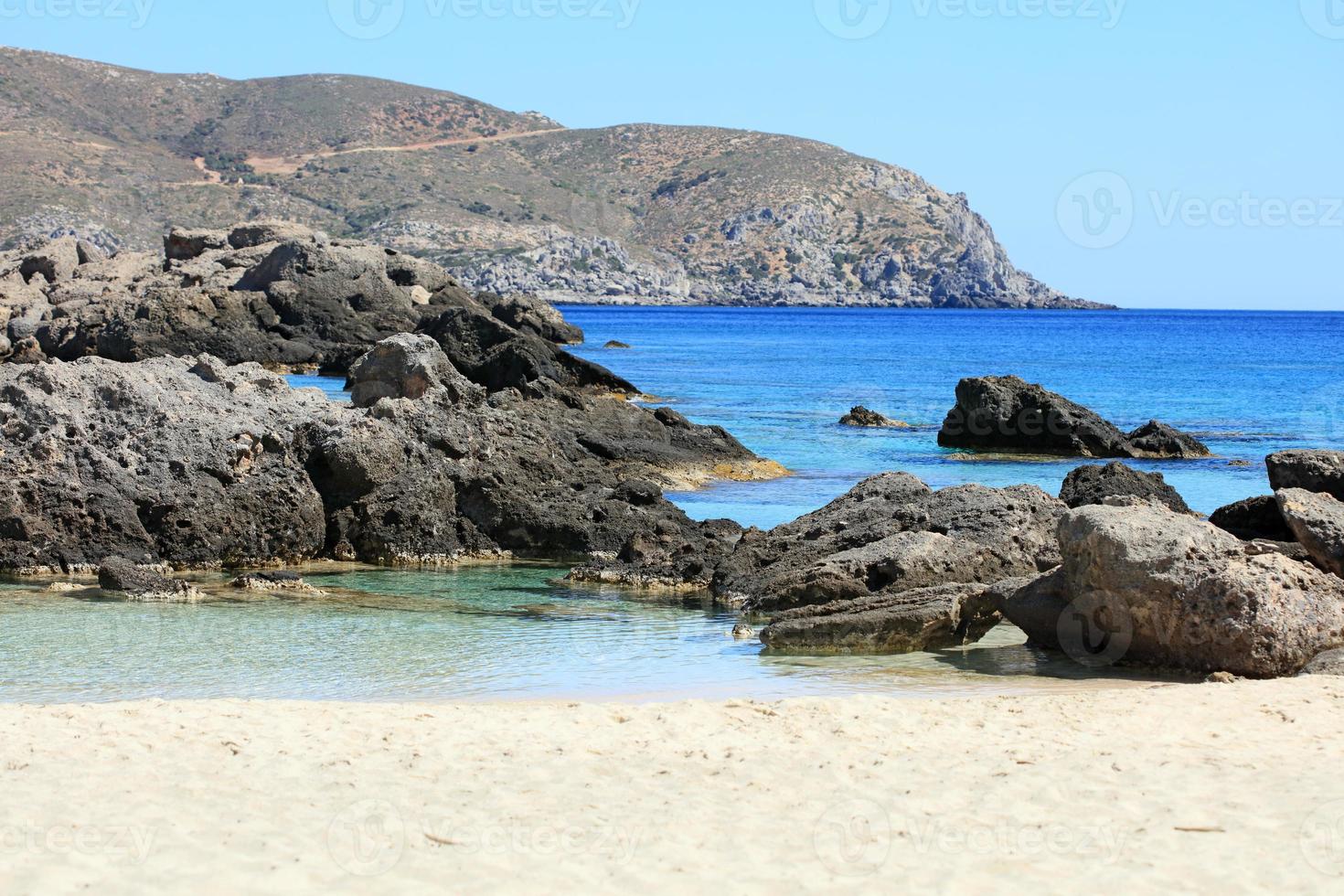 kedrodasos strand Kreta ö Grekland blå lagun kristallvatten koraller foto