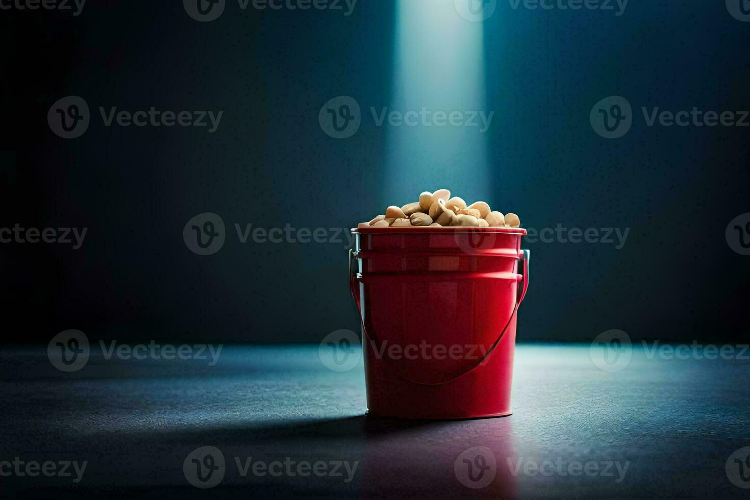 en röd hink fylld med popcorn på en mörk tabell. ai-genererad foto