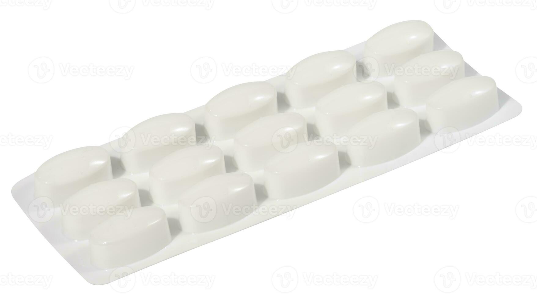 oval tabletter i vit plast förpackning foto