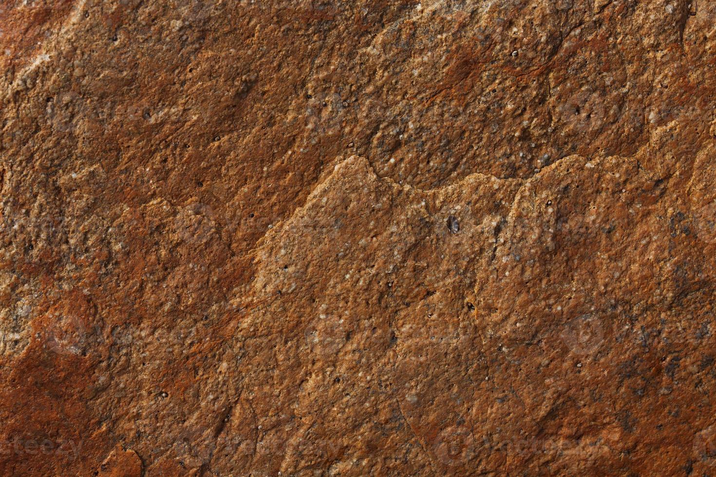 ojämn yta av brun sten foto