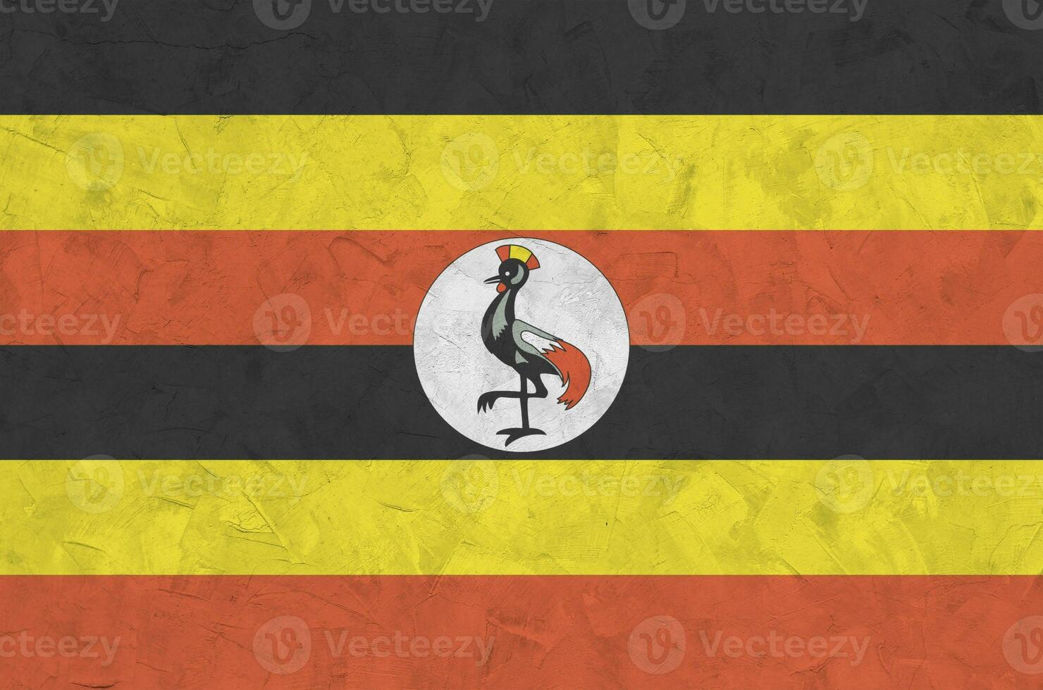 uganda flagga avbildad i ljus måla färger på gammal lättnad putsning vägg. texturerad baner på grov bakgrund foto