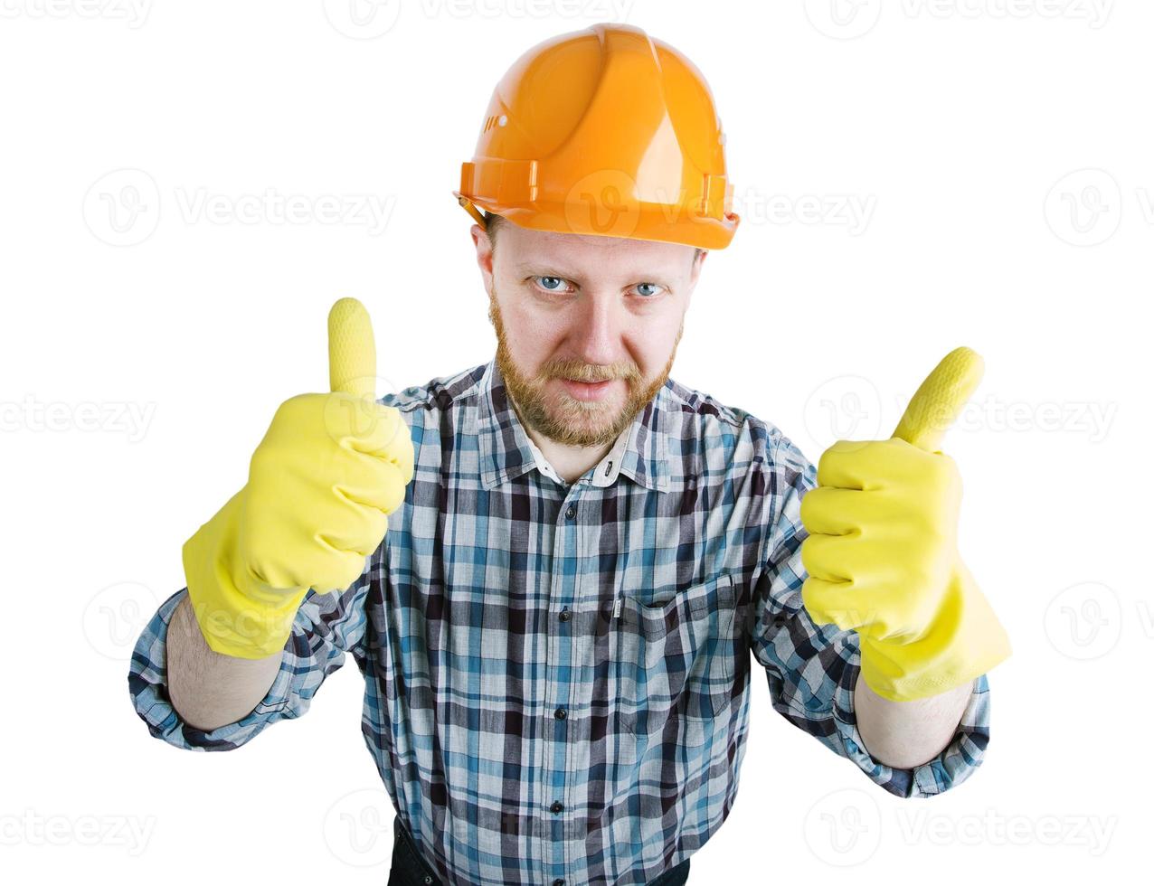 man i en orange konstruktionshjälm och handskar foto