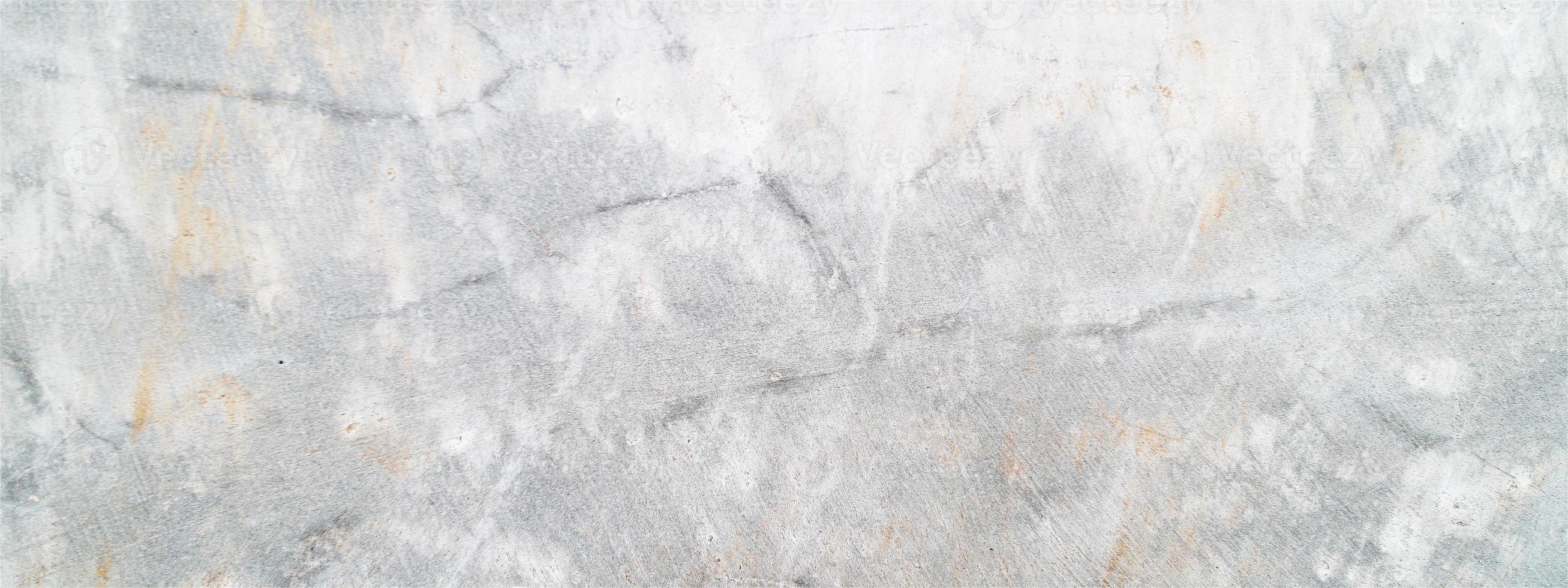 grå betong bakgrund. vit smutsig gammal cementstruktur. grunge av gammal betong foto
