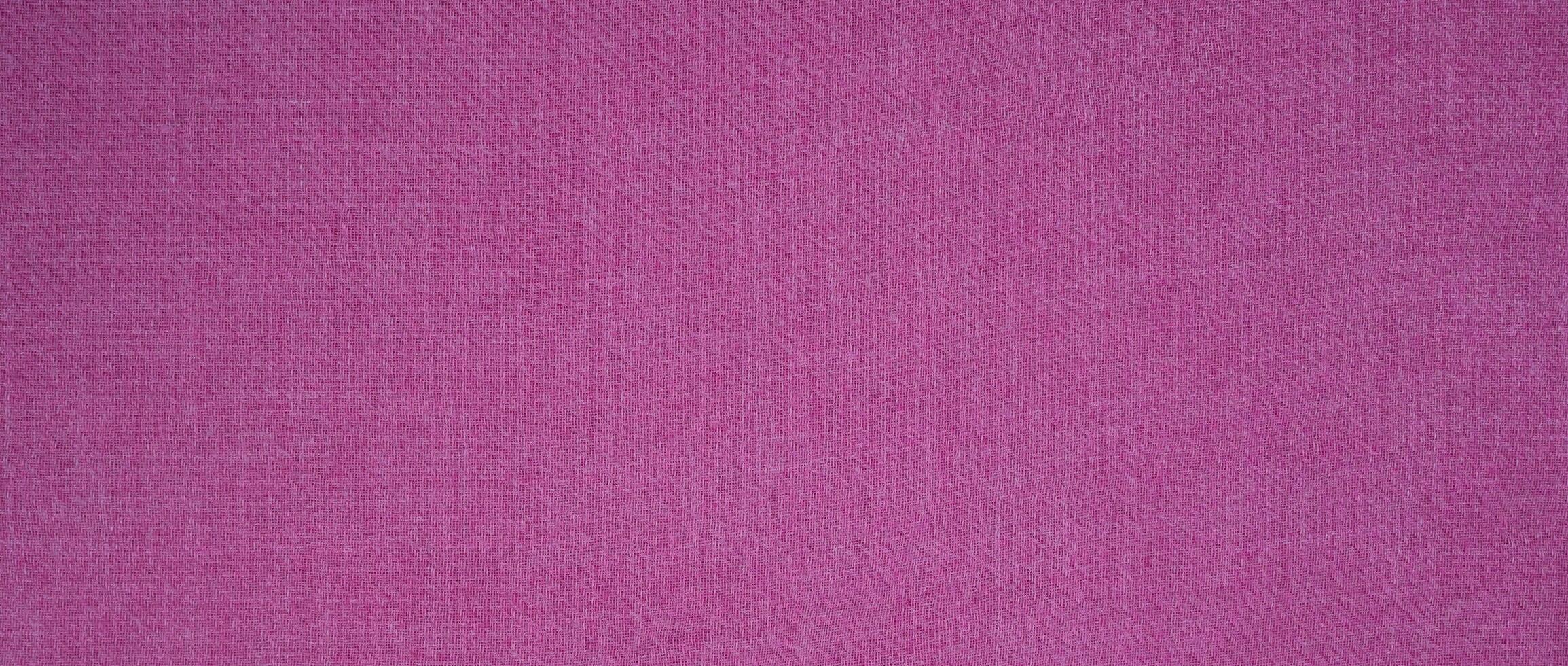 de textur av de bomull tyg är rosa. naturlig bakgrund. baner. topp se. kopia Plats. selektiv fokus. foto